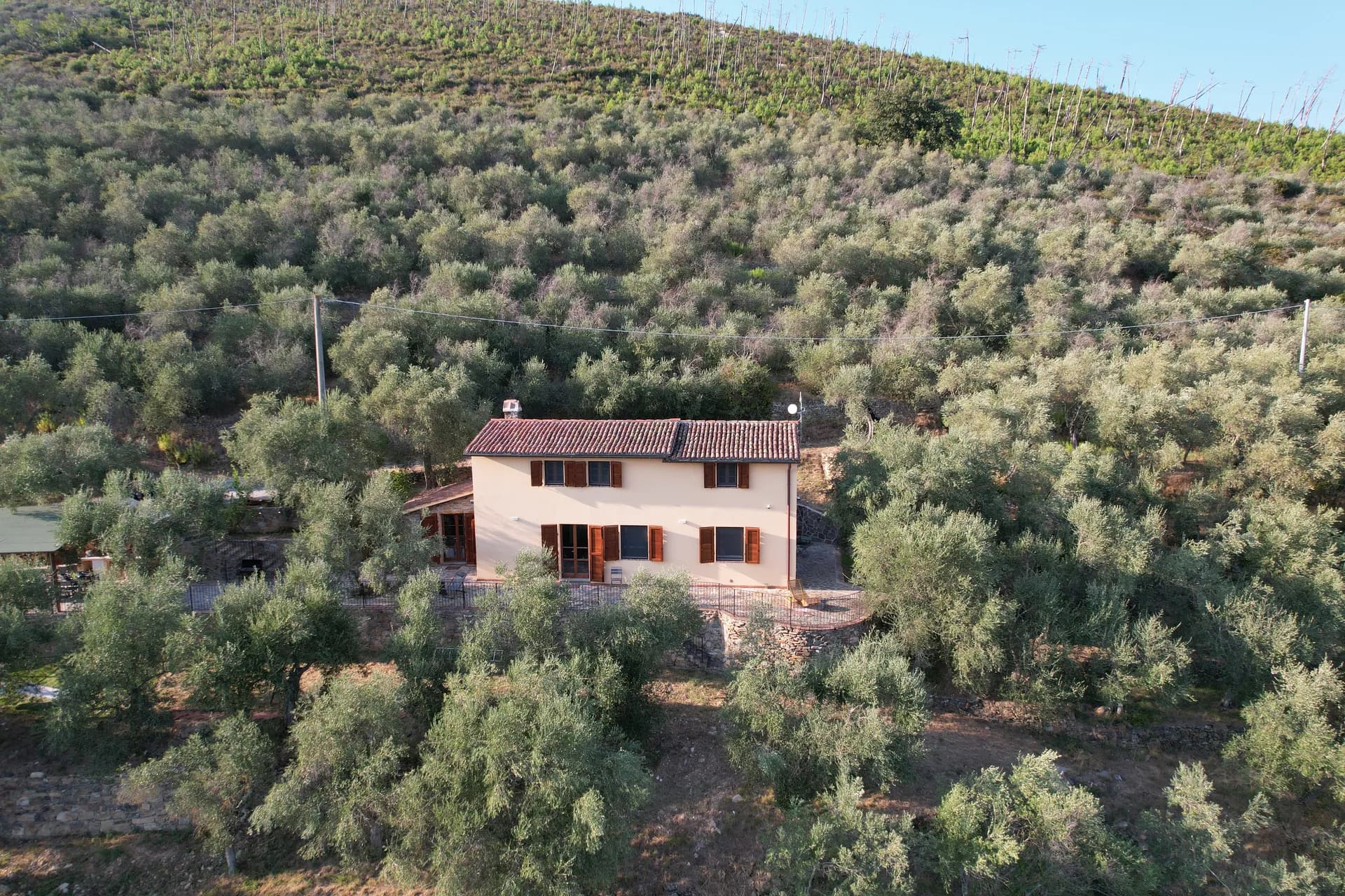 Timber shutters and stone walls at Casale Eleo
