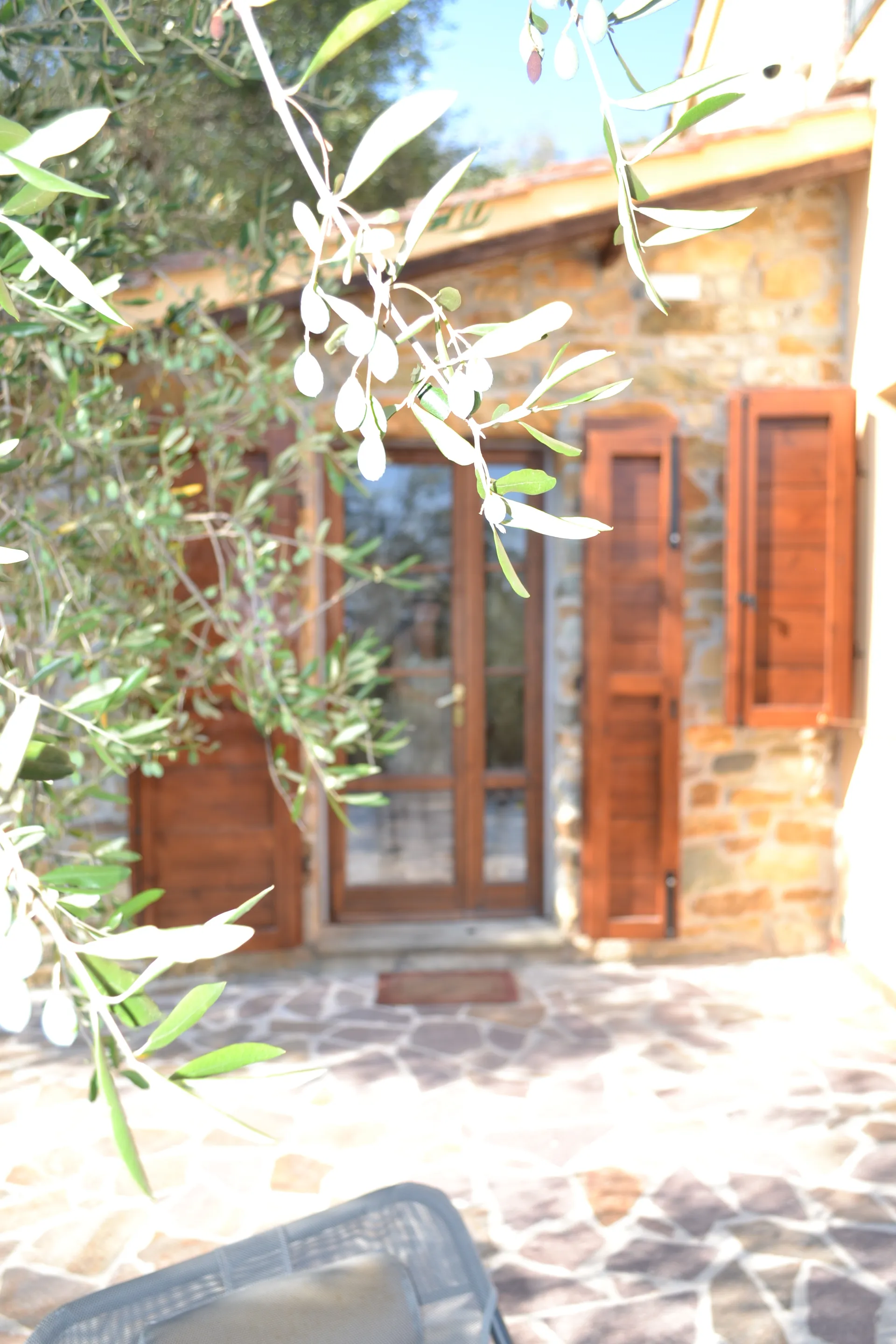 Timber shutters and stone walls at Casale Eleo