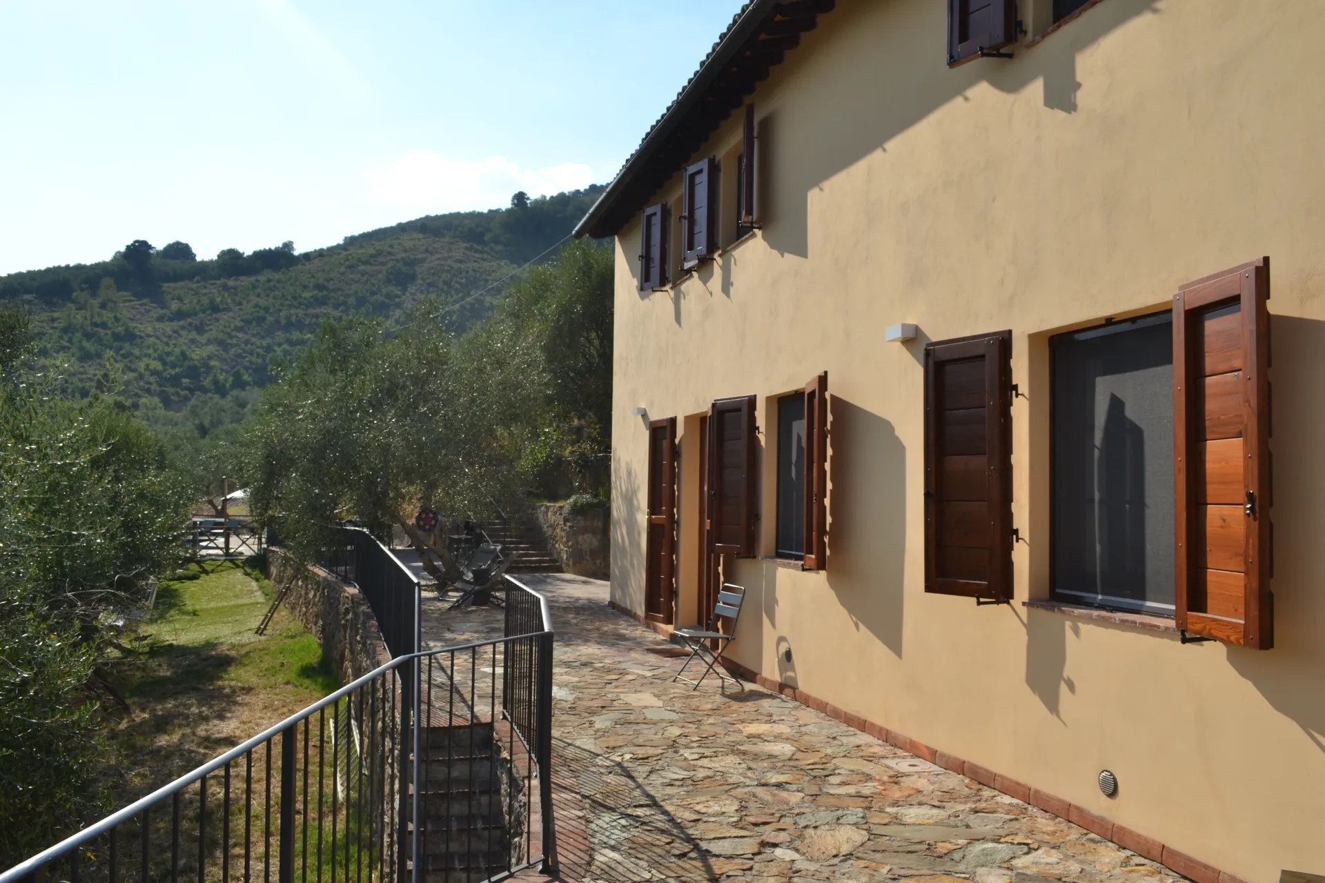 Timber shutters and stone walls at Casale Eleo