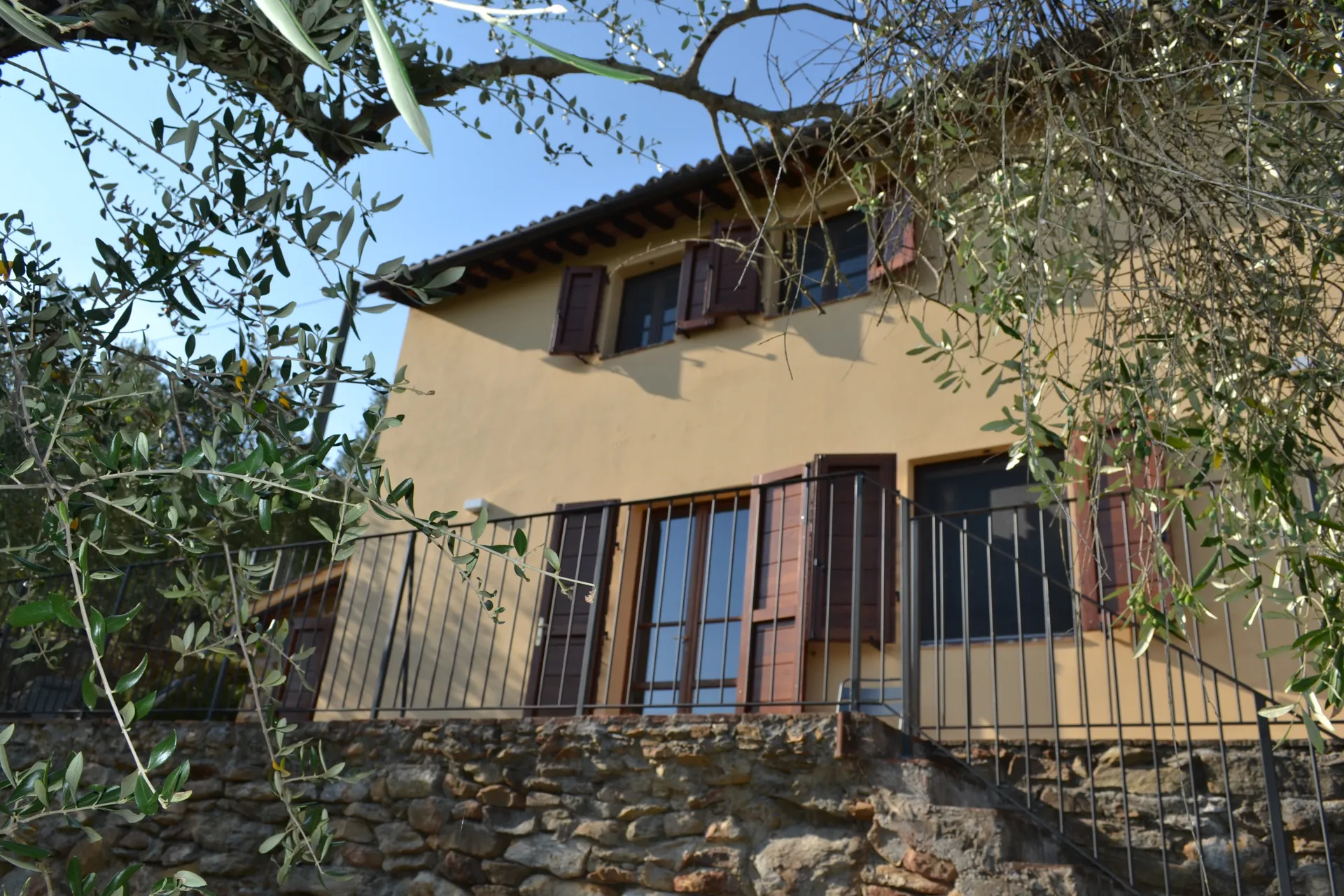 Timber shutters and stone walls at Casale Eleo