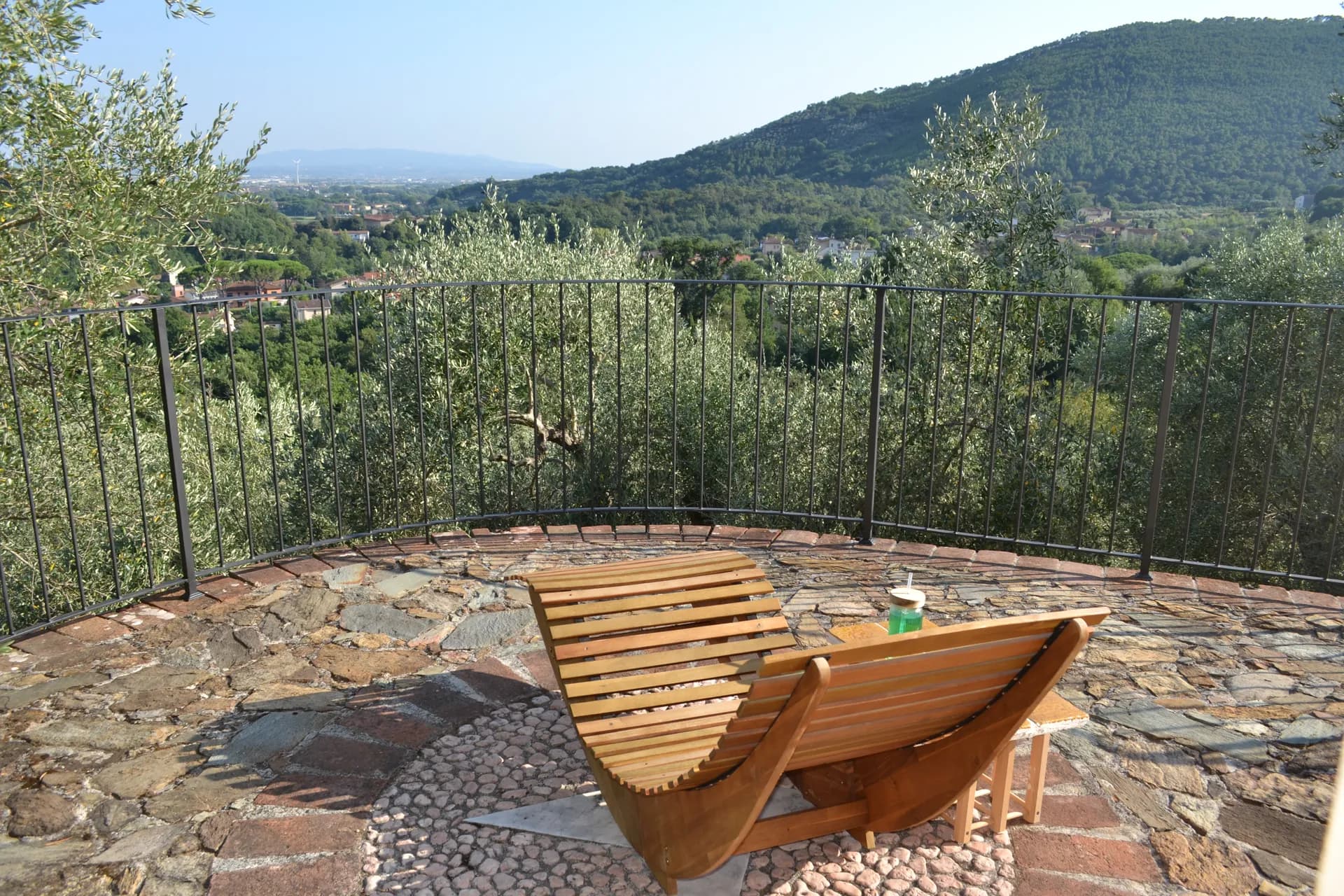 A hammock strung between olive trees at Casale Eleo