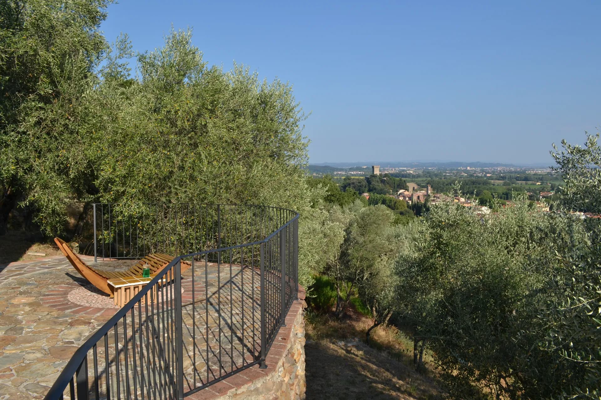 A hammock strung between olive trees at Casale Eleo