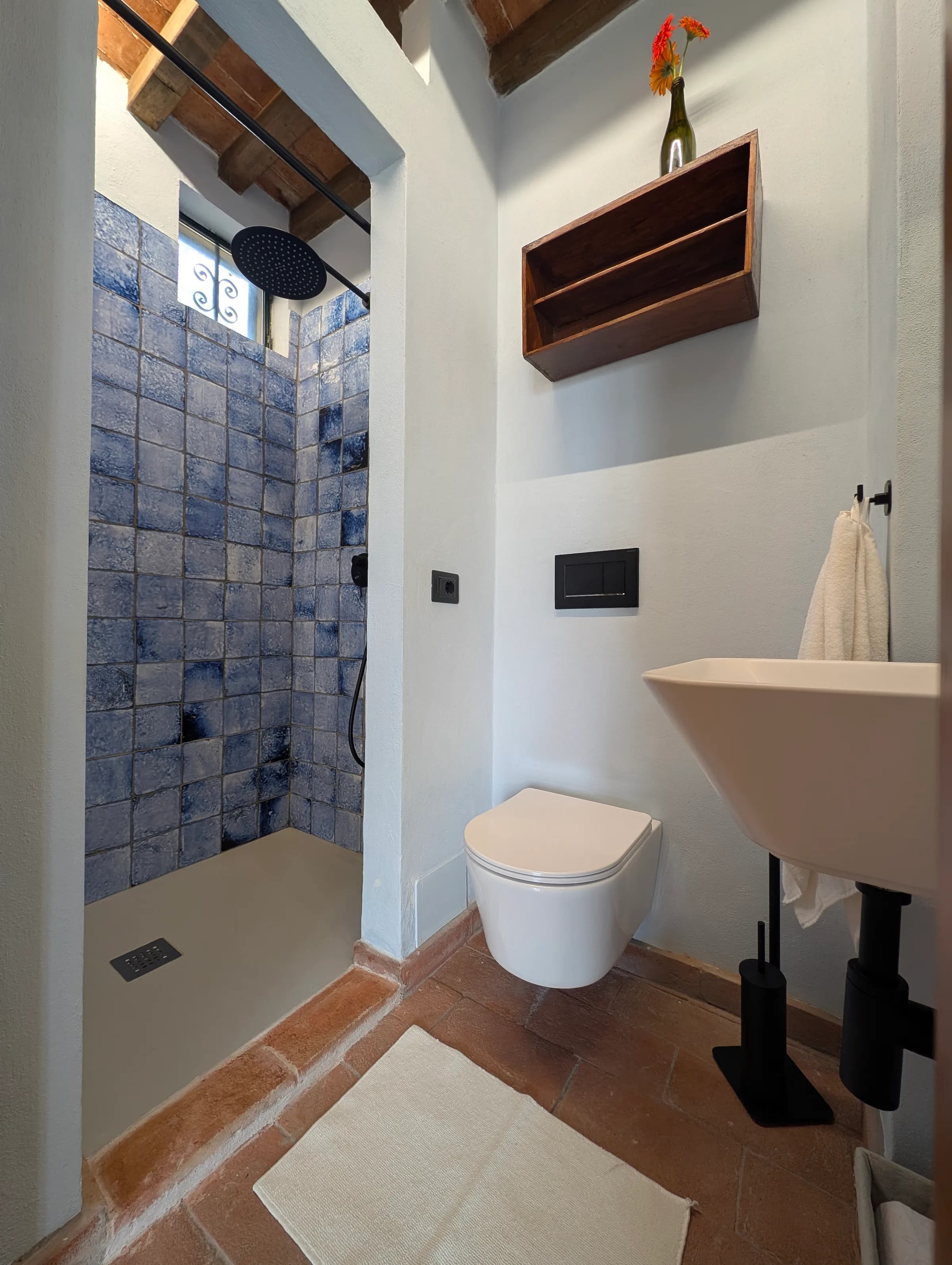 Bathroom with blue-grey zellige tiles and a walk-in shower