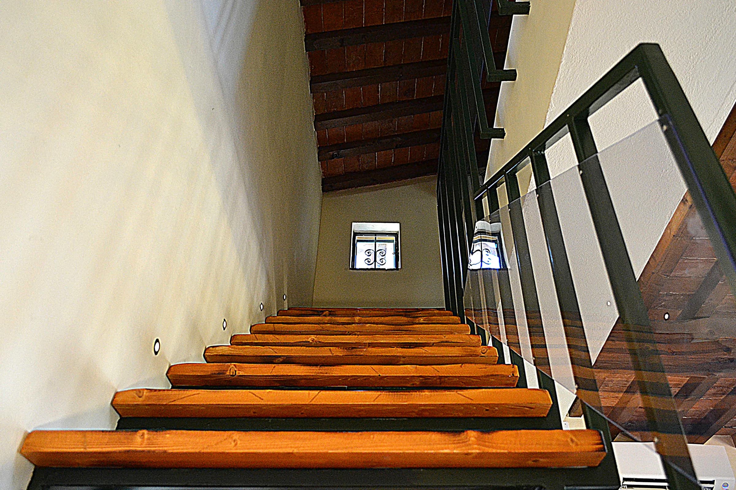 The floating timber staircase with its glass balustrade