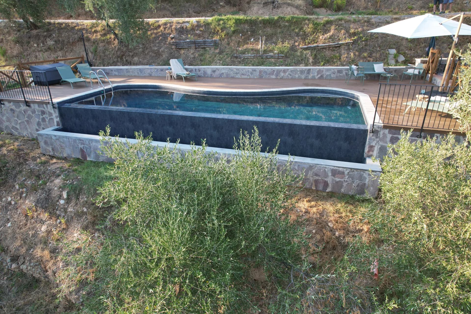 The pool deck and loungers at Casale Eleo