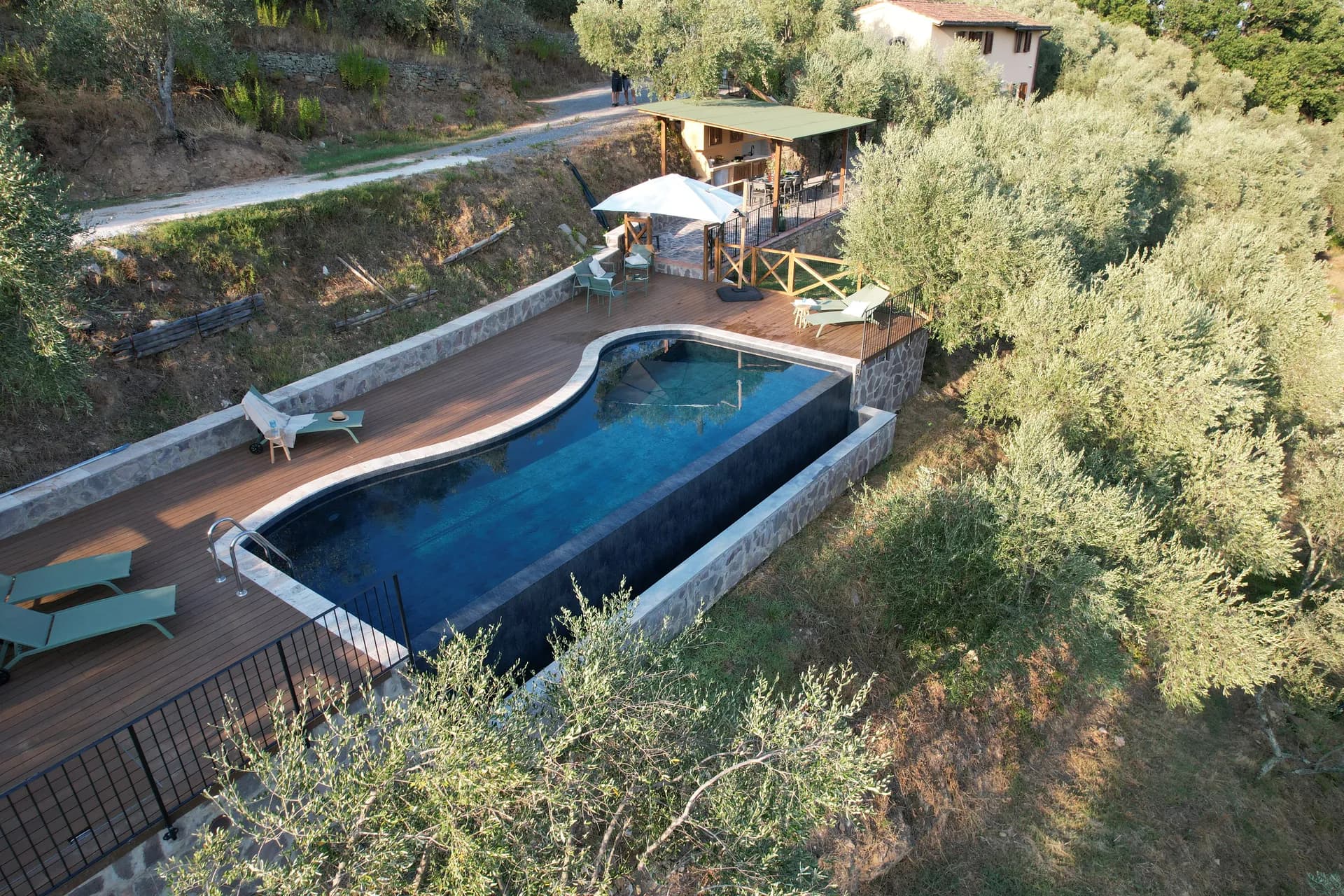 The pool deck and loungers at Casale Eleo