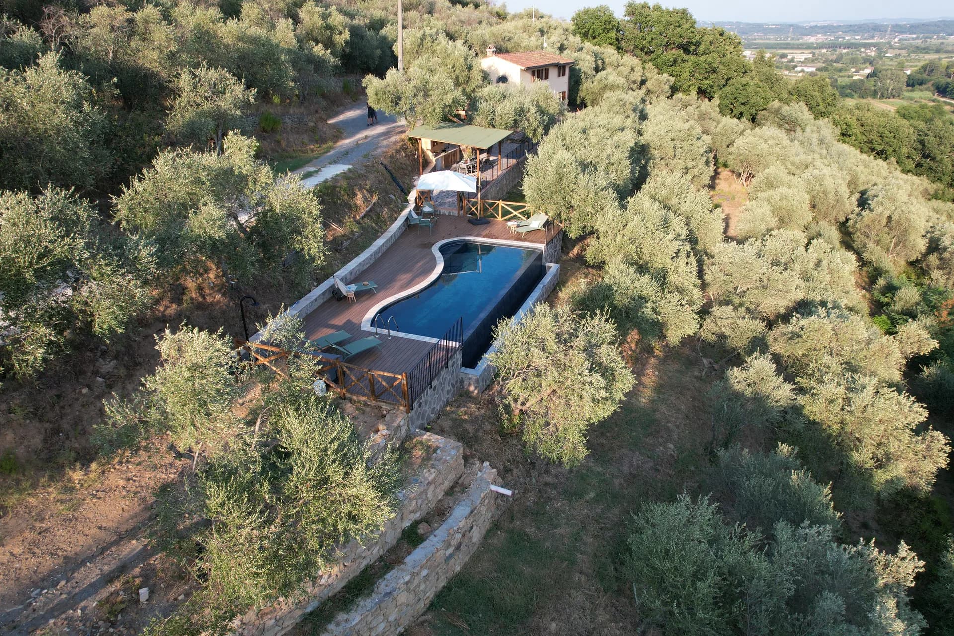 The pool deck and loungers at Casale Eleo