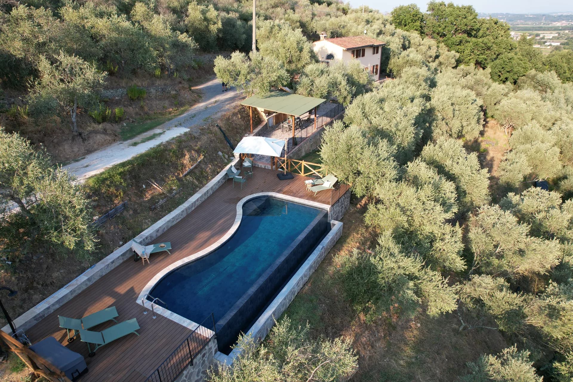 The pool deck and loungers at Casale Eleo