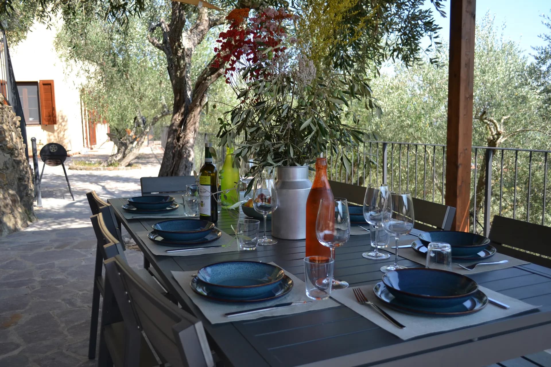 The shaded gazebo and outdoor kitchen beside the pool