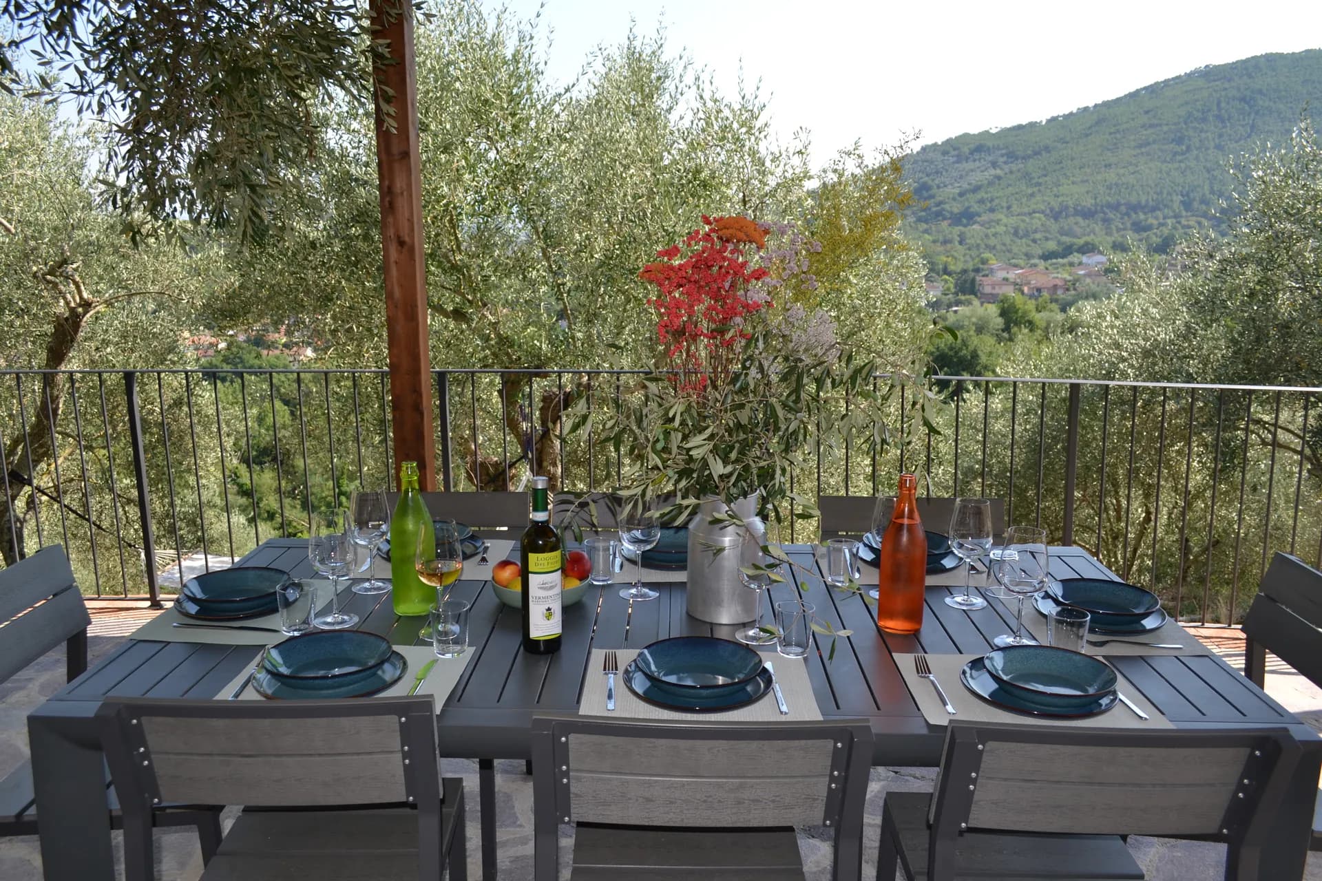 The shaded gazebo and outdoor kitchen beside the pool