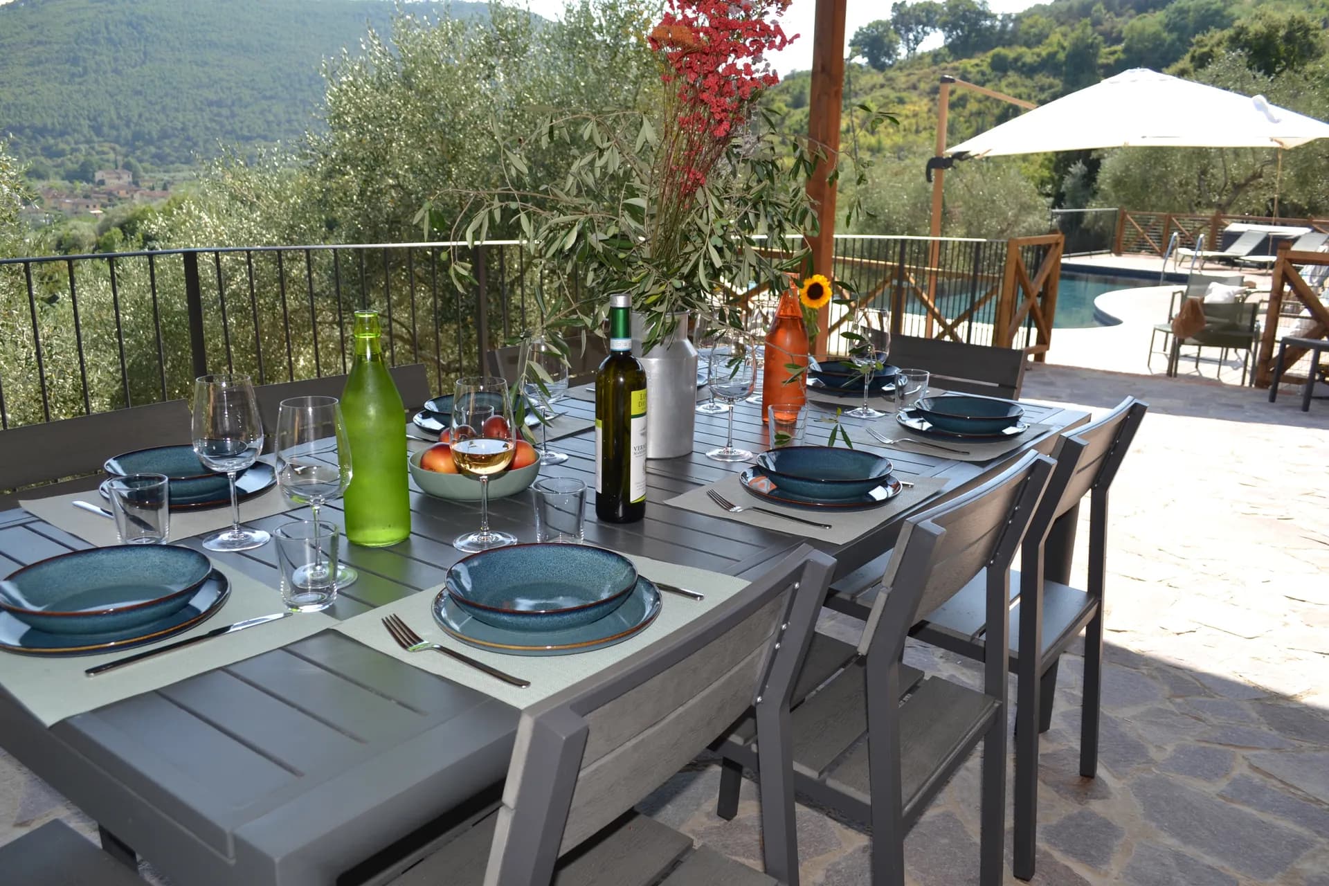 The pool deck and loungers at Casale Eleo