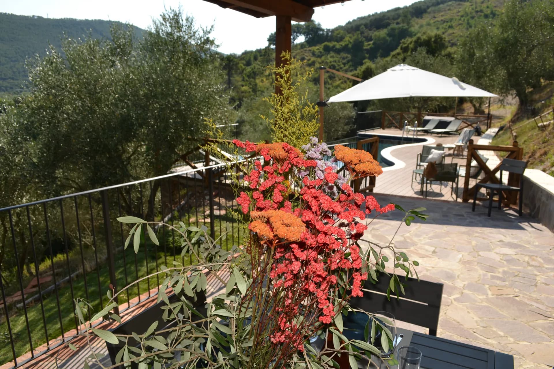 A table laid for dinner under the gazebo at Casale Eleo