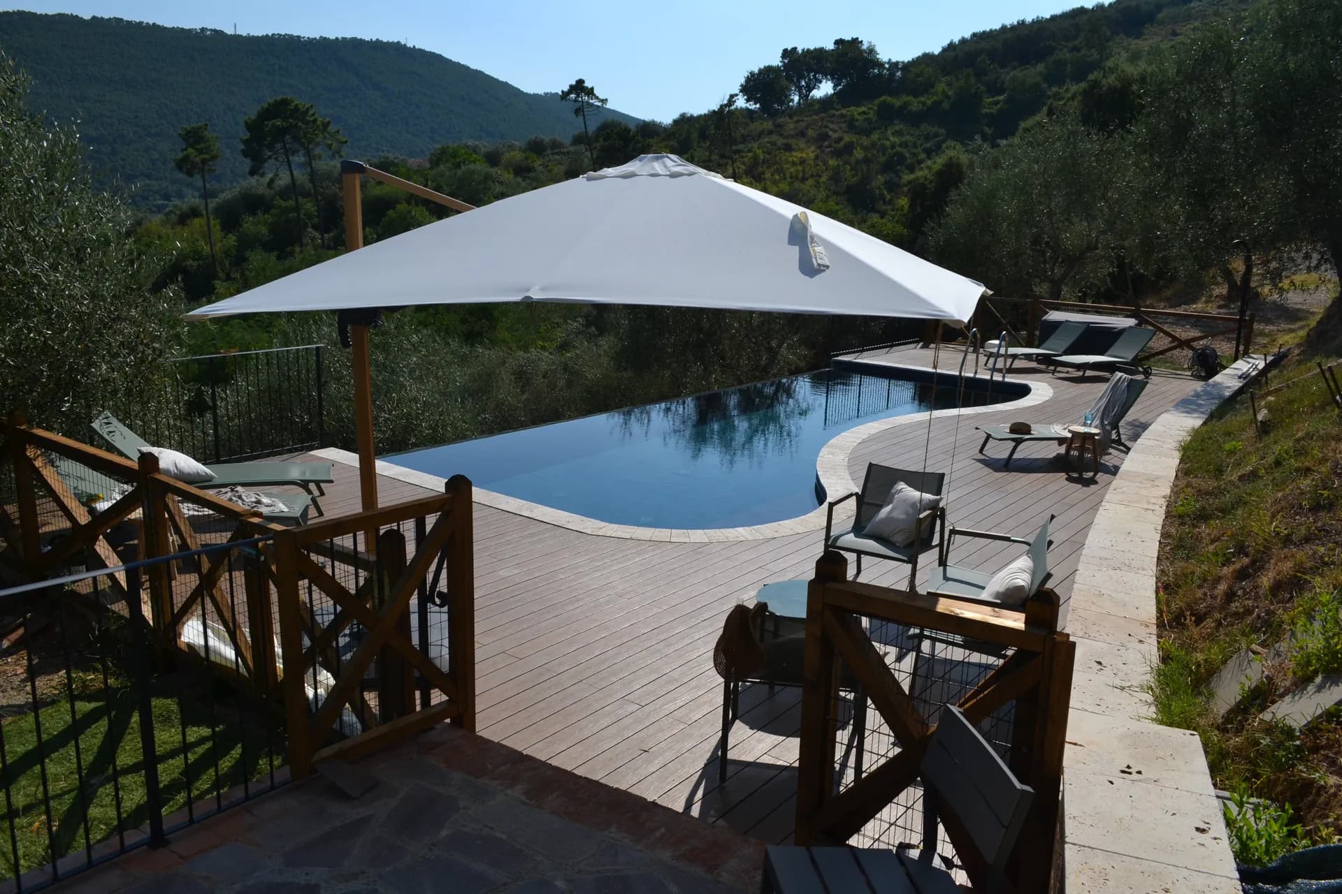 The pool deck and loungers at Casale Eleo
