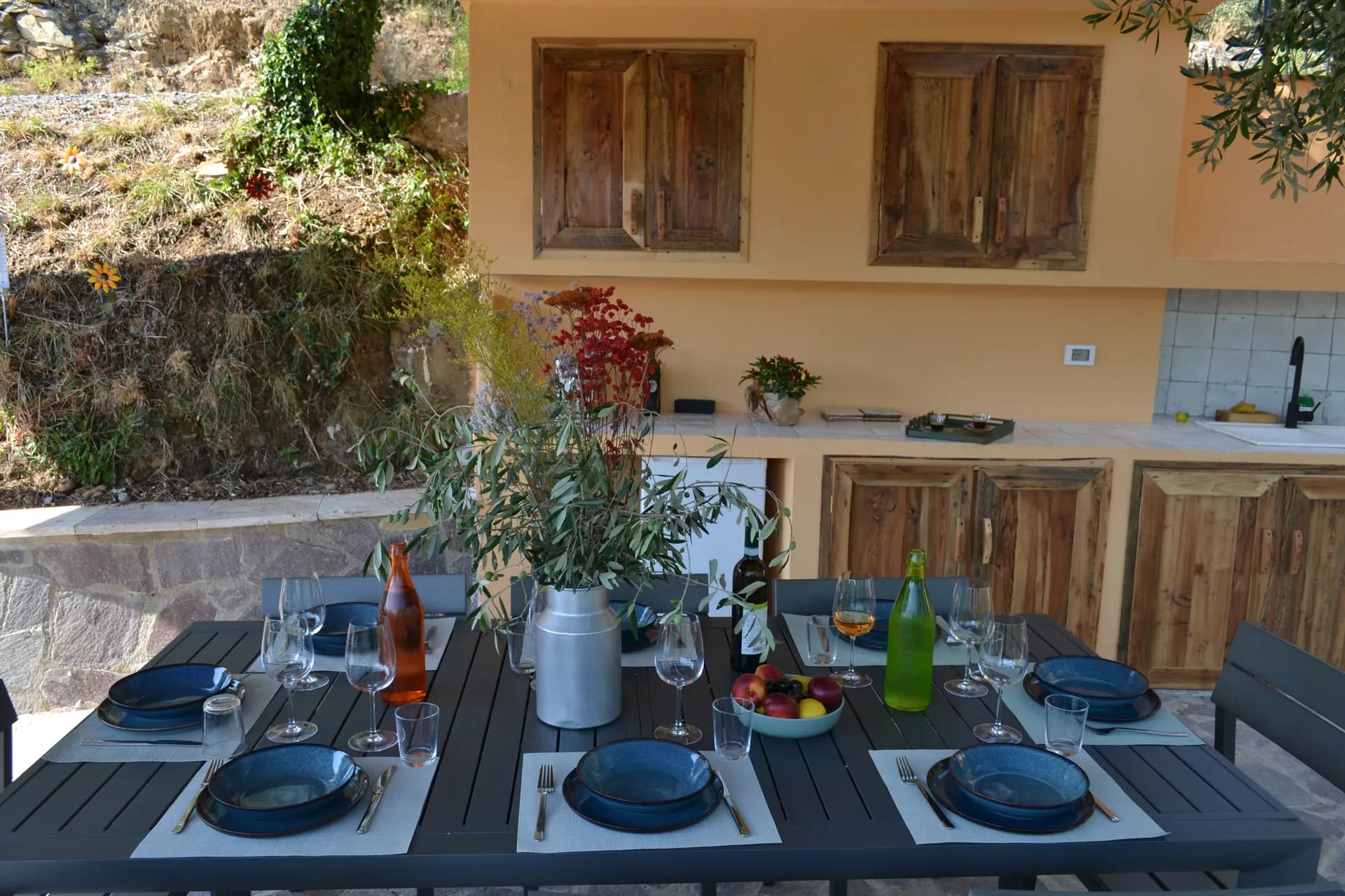The shaded gazebo and outdoor kitchen beside the pool