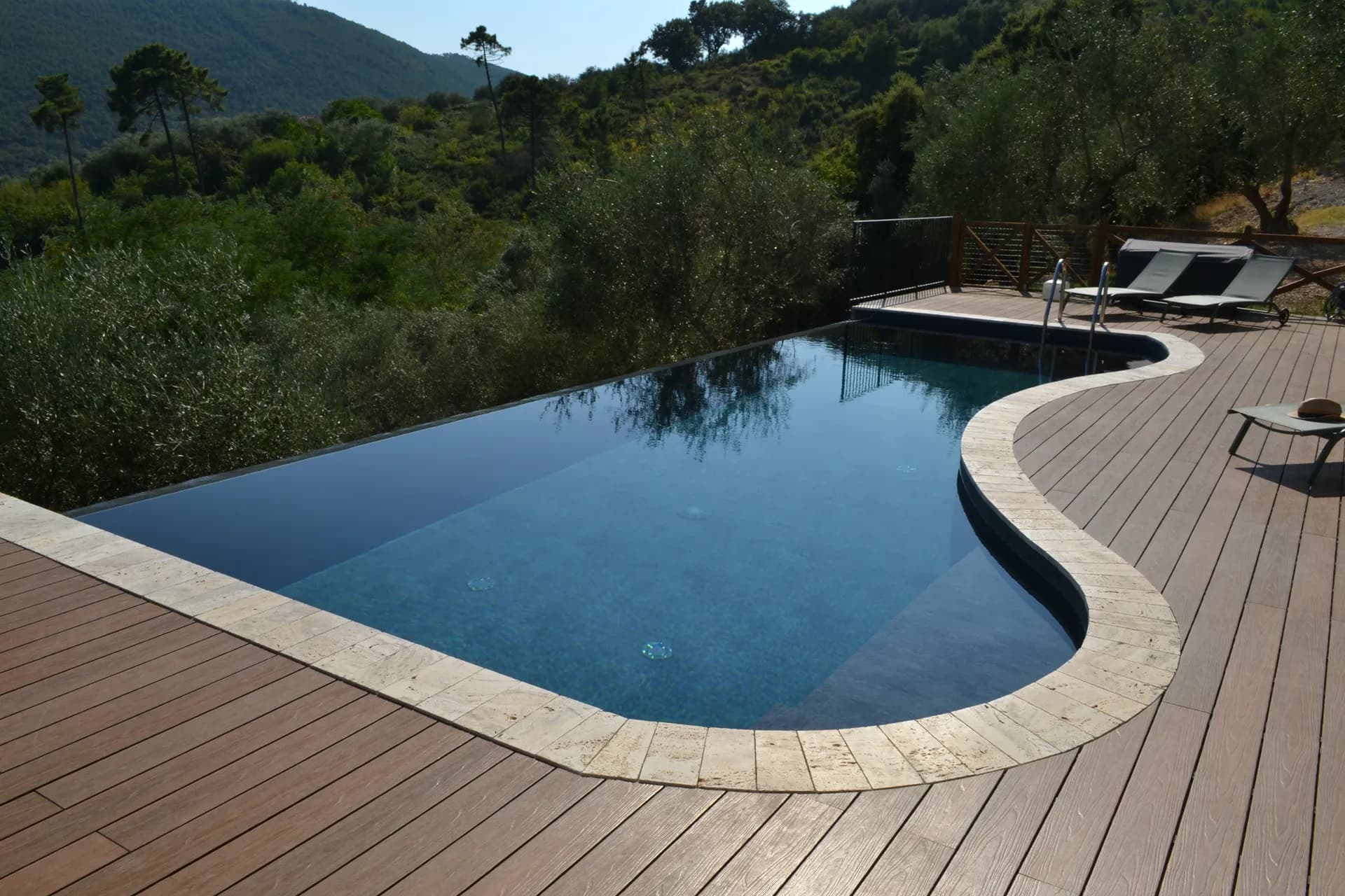 The pool deck and loungers at Casale Eleo