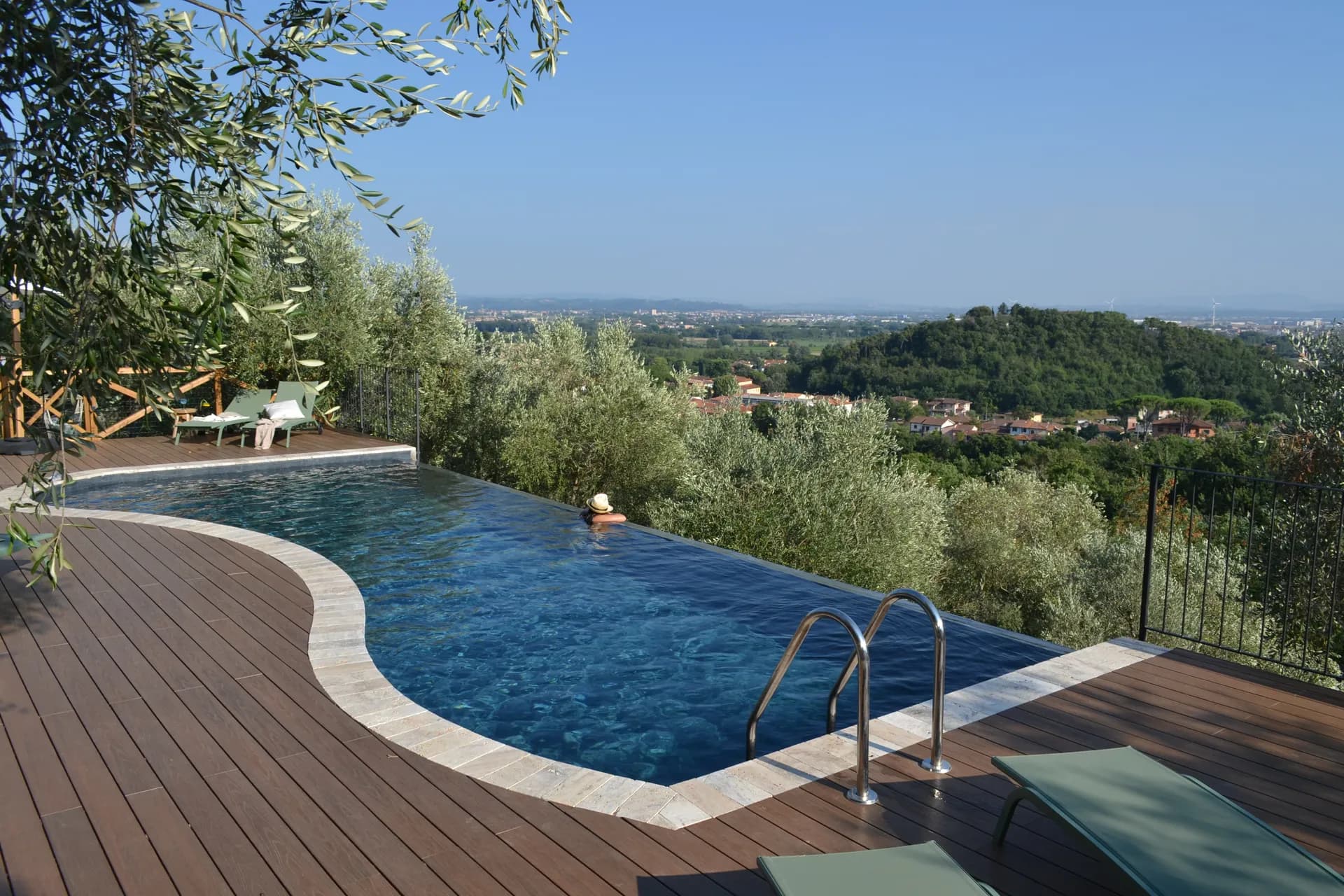 The pool deck and loungers at Casale Eleo
