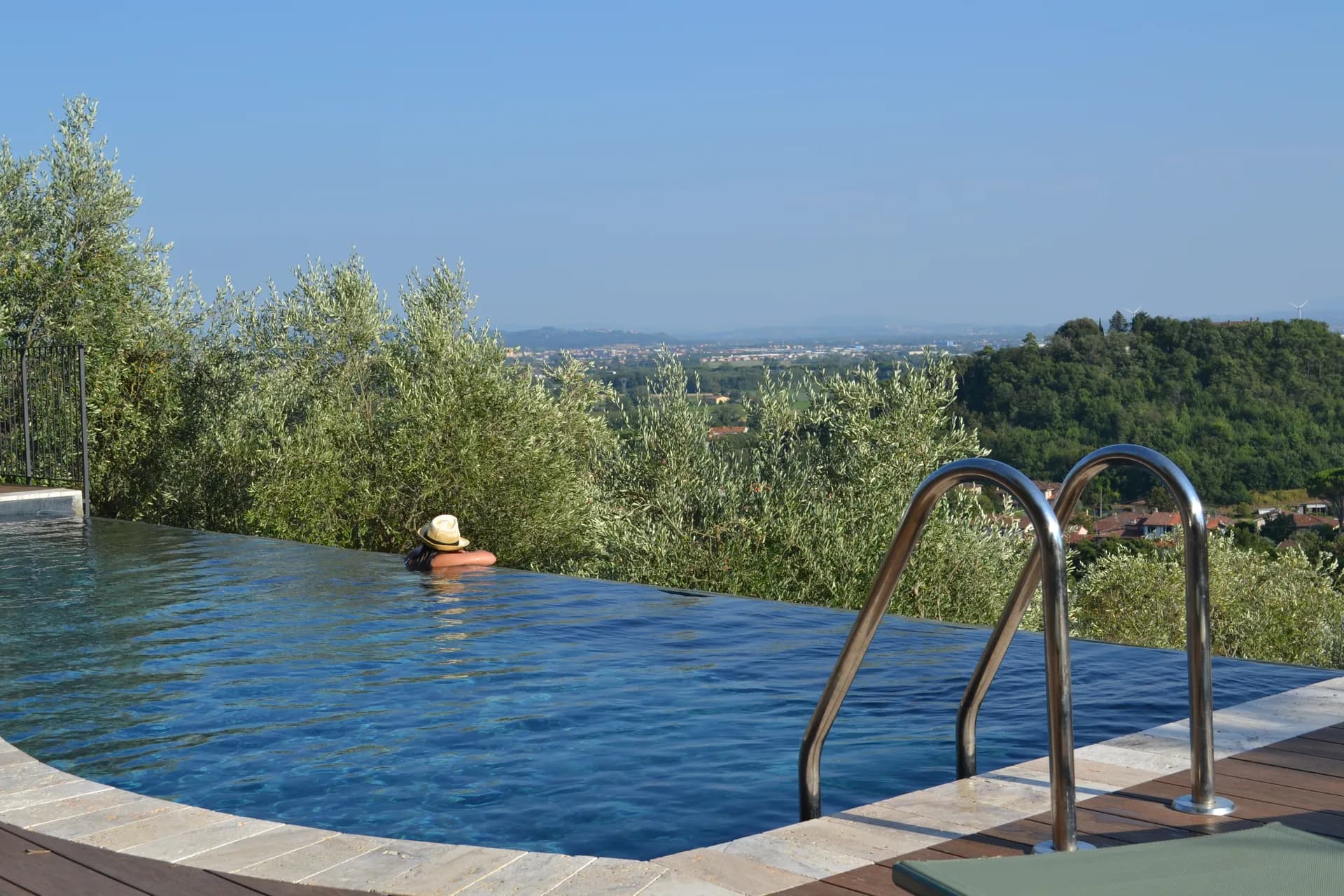 The shaded gazebo and outdoor kitchen beside the pool