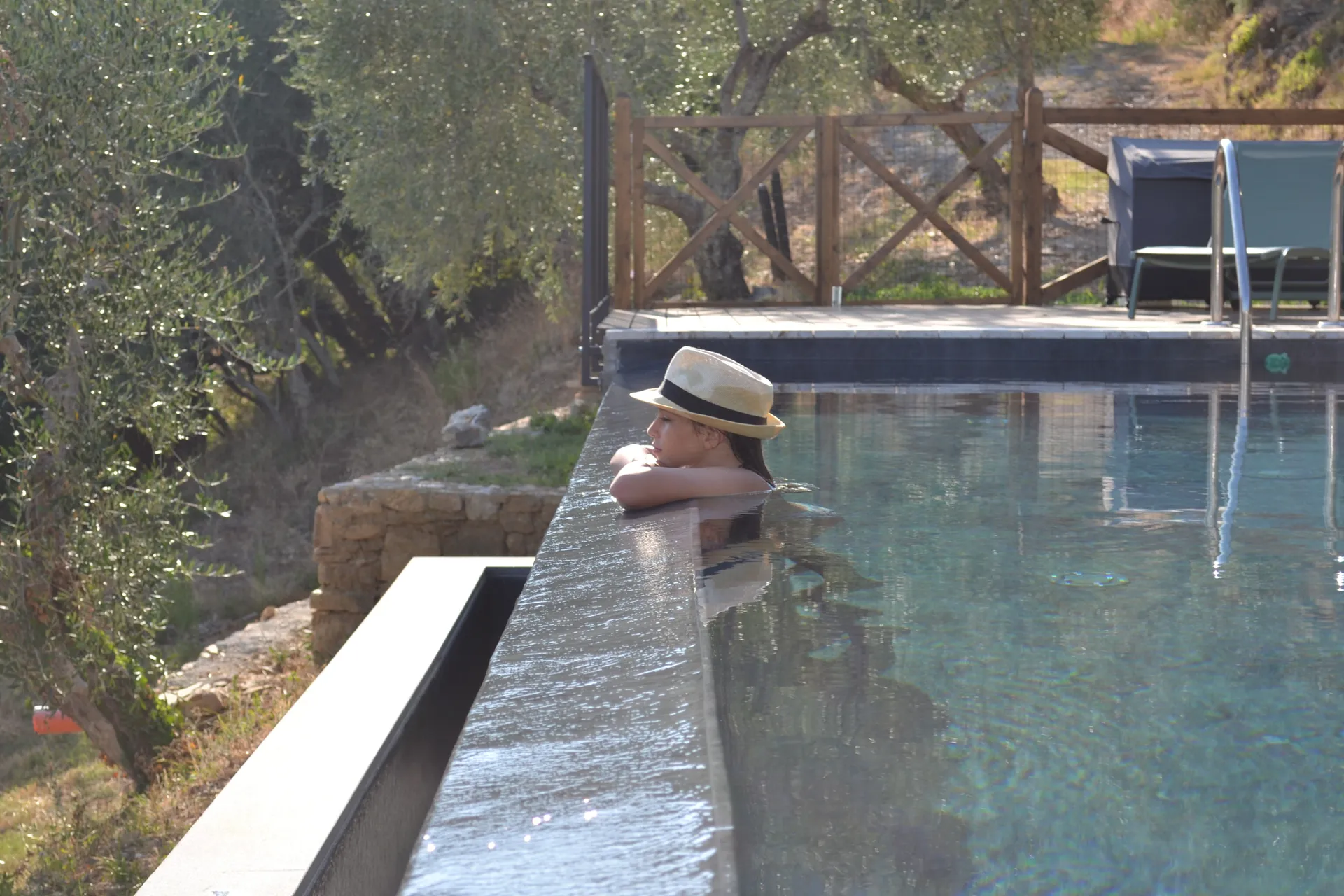 The shaded gazebo and outdoor kitchen beside the pool