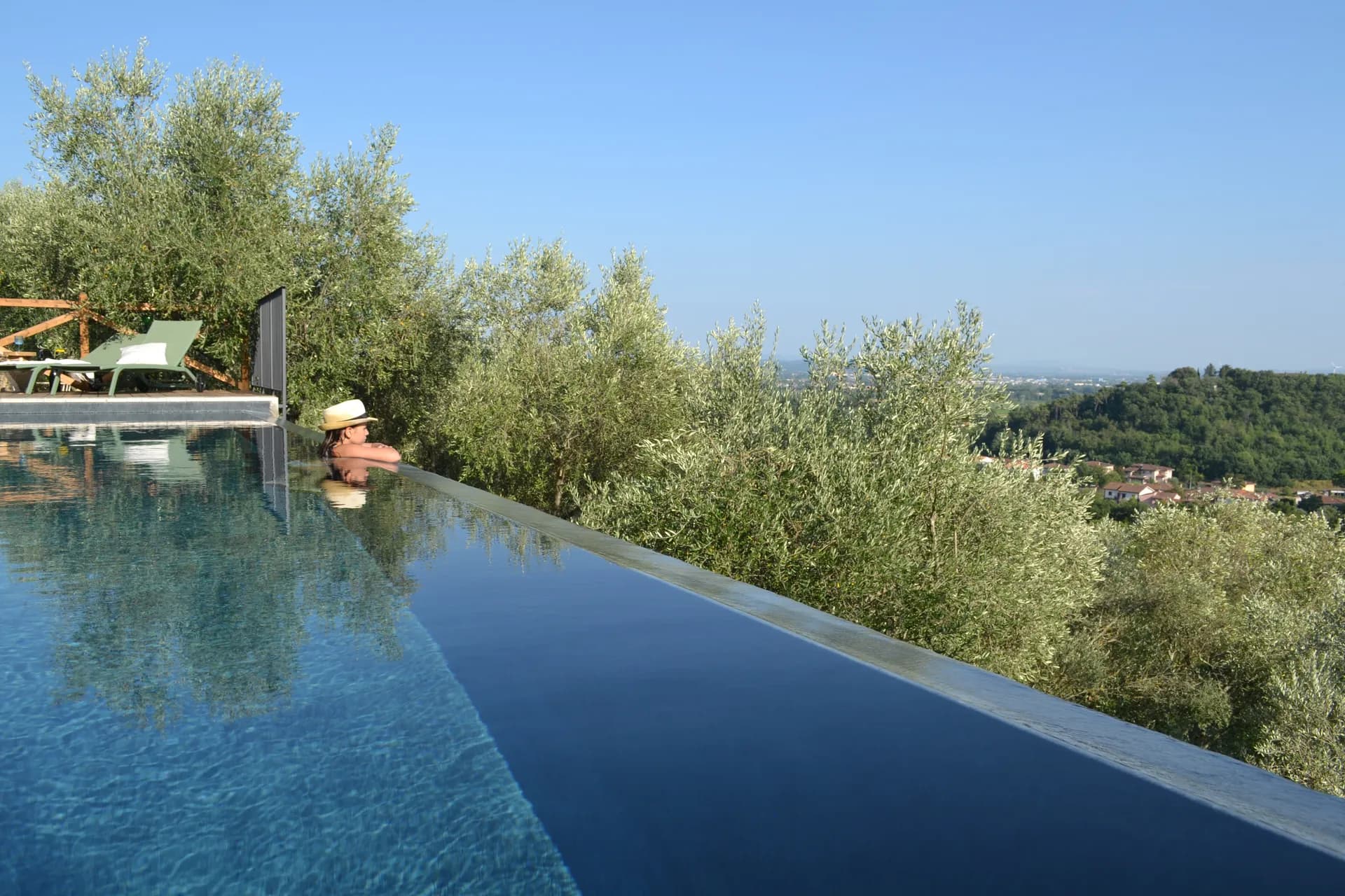 The pool deck and loungers at Casale Eleo