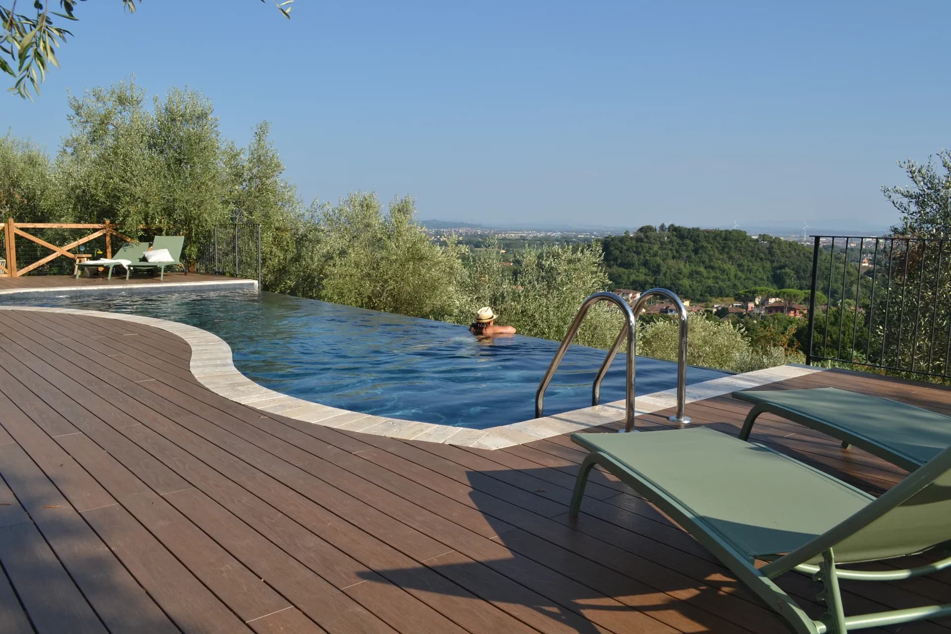 The pool deck and loungers at Casale Eleo