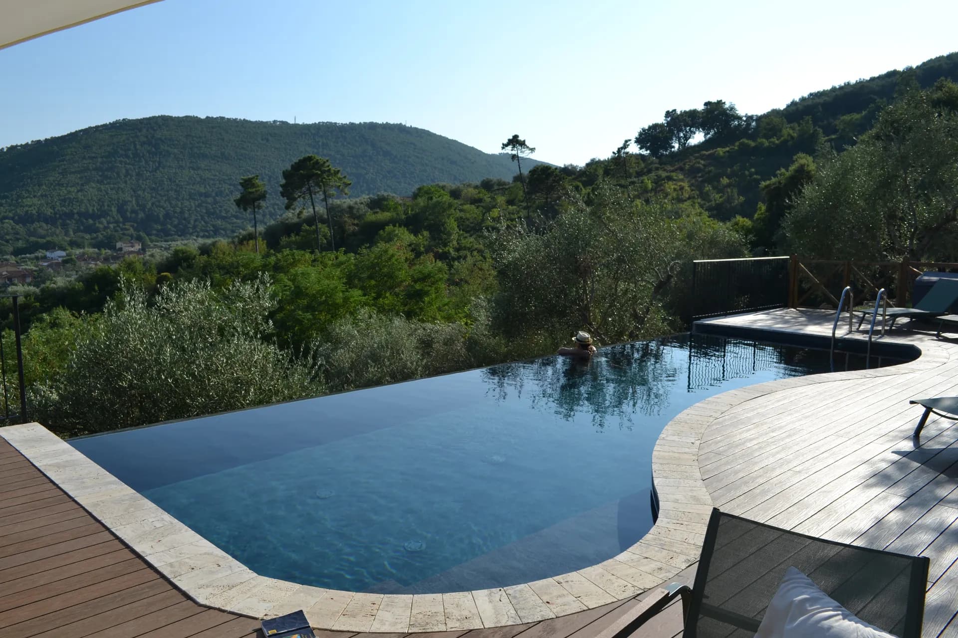 The pool deck and loungers at Casale Eleo