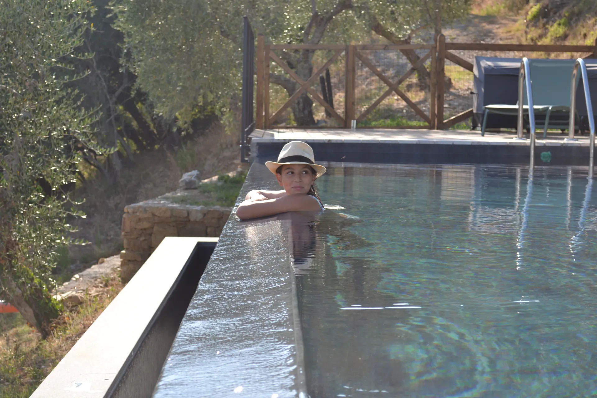 The pool deck and loungers at Casale Eleo